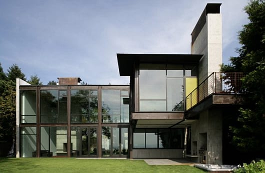 A modern glass house with sharp angles.