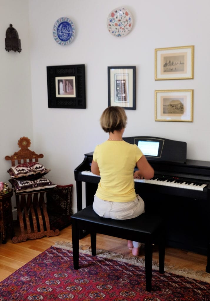 Woman with dedicated home space for her piano.